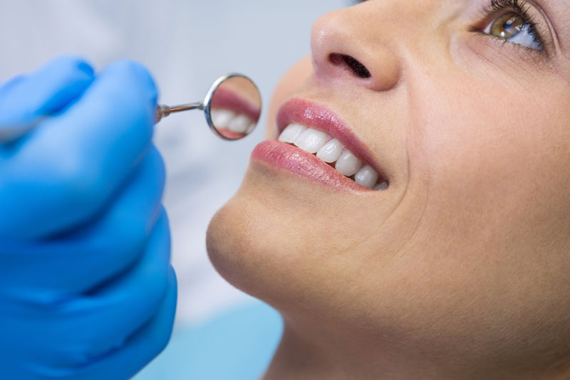 patient undergoing dental cleaning